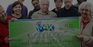 LOTTO MAX winners holding cheque