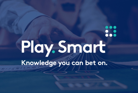 Playsmart lottery logo, croupier with playing card in a casino