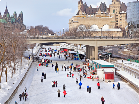 People skating over a frozen Rideau Canal in Ottawa, Canada.