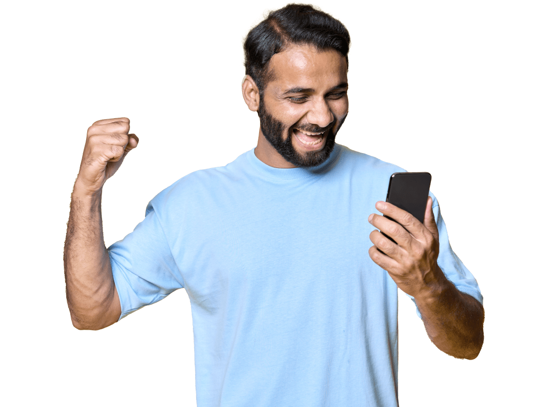 A person wearing a blue t-shirt, looking very excited while looking at their smartphone.